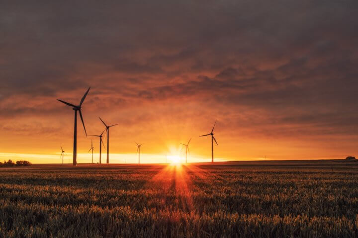 Photo of wind turbines and a sunset - how we achieve sustainable web design?