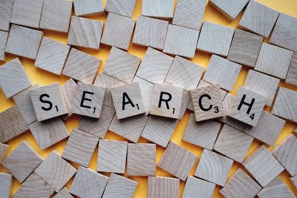 Scrabble tiles spelling out the word "search"