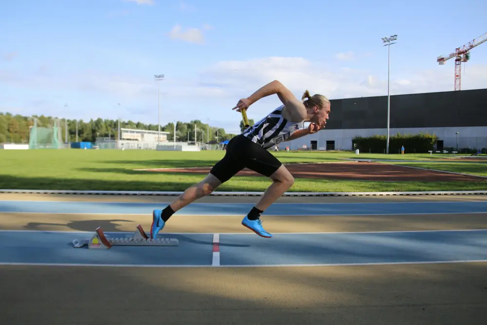 Sprinter starting a race on a running track